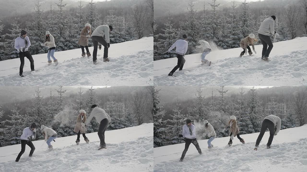 年轻人滚雪球打雪仗冰雪运动冬天扔雪球