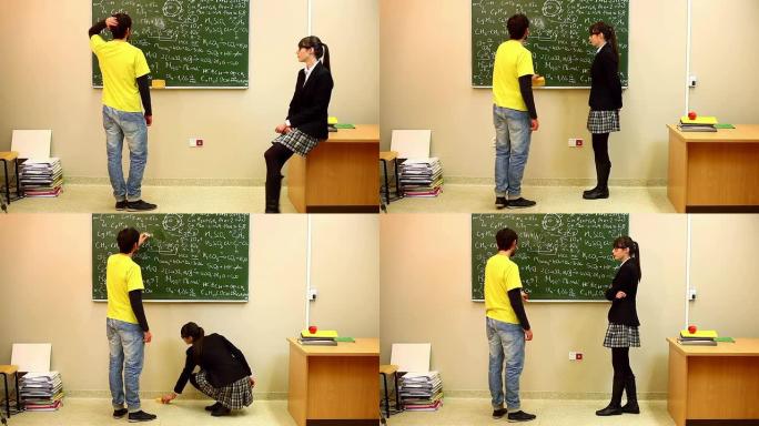 男孩在黑板上看数学题