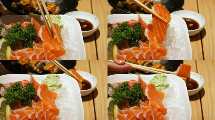 用筷子吃三文鱼生鱼片，日本食物