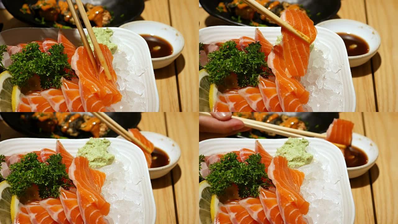 用筷子吃三文鱼生鱼片，日本食物