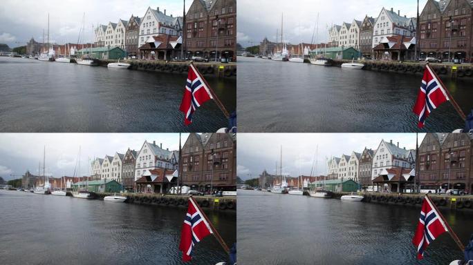 挪威国旗和卑尔根的布莱根古城