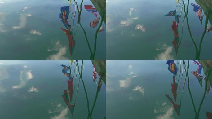亚洲国旗在水面上的反射