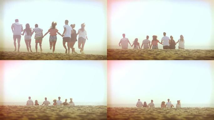 日落时在沙滩上奔跑的一群朋友