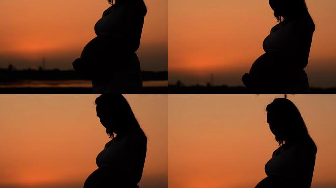 孕妇剪影瑜伽是夕阳