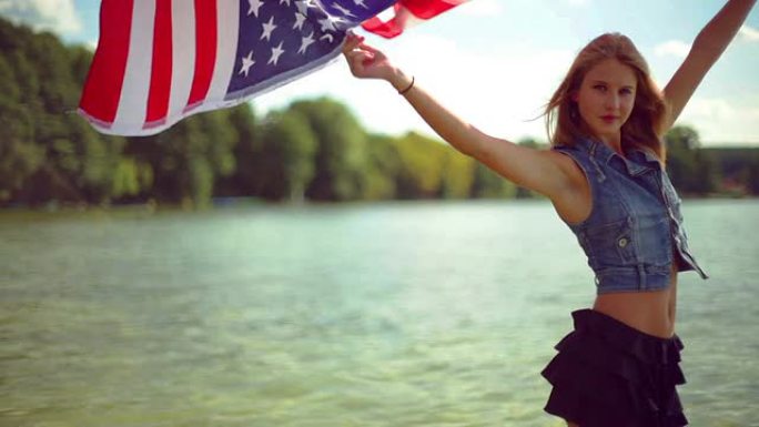 女孩挥舞着美国国旗。
