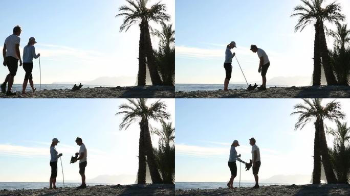 情侣们沿着空旷的海滩散步，发现漂流木