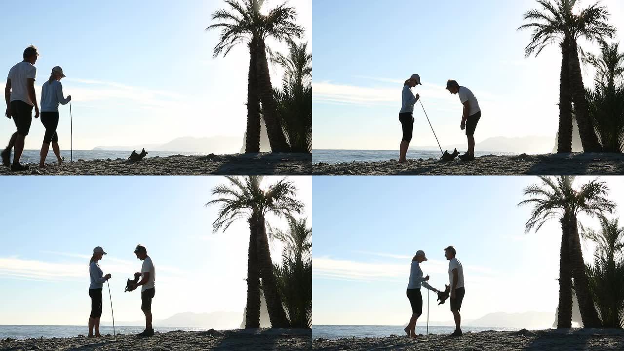 情侣们沿着空旷的海滩散步，发现漂流木