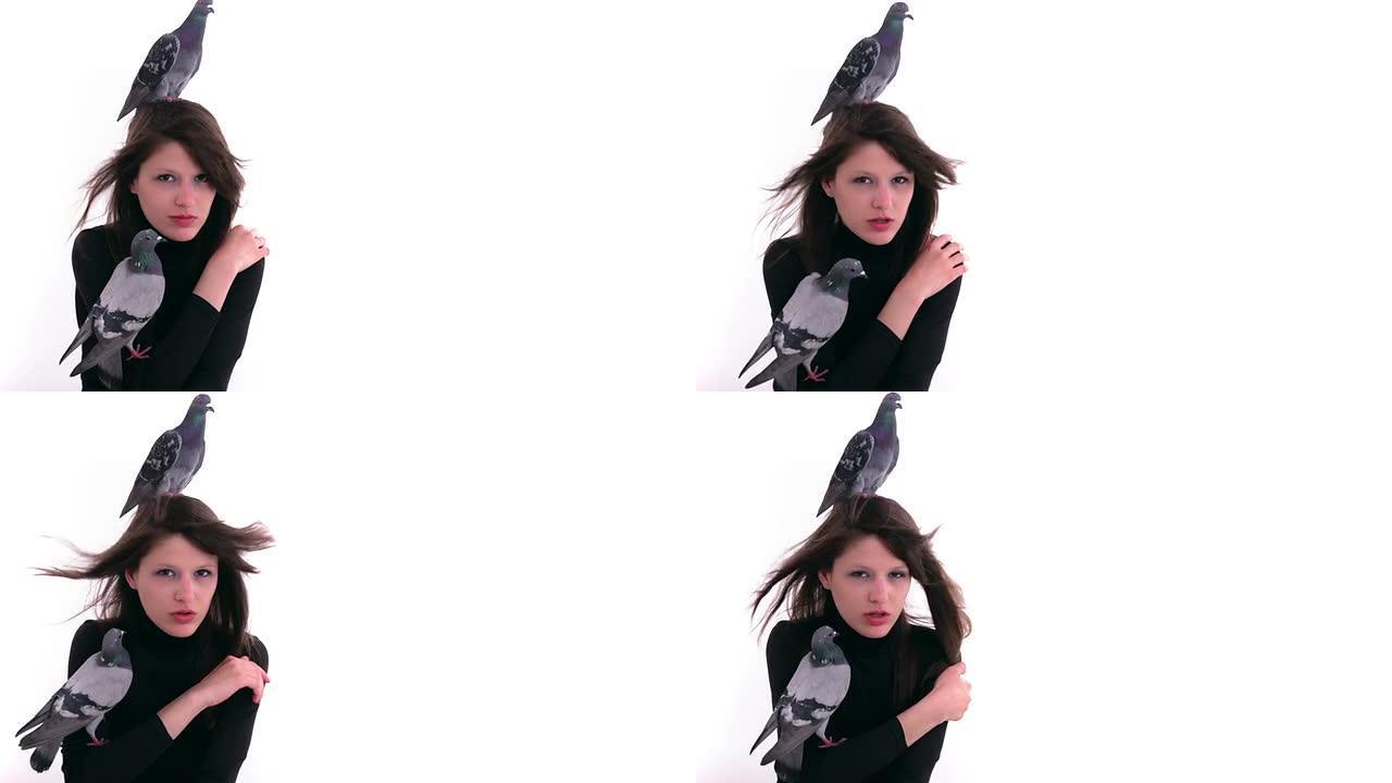 两只鸽子坐在女人的肩膀和头上