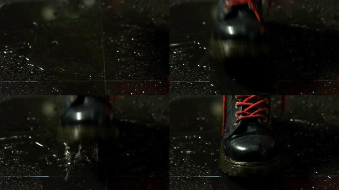 靴子溅在潮湿的地板上