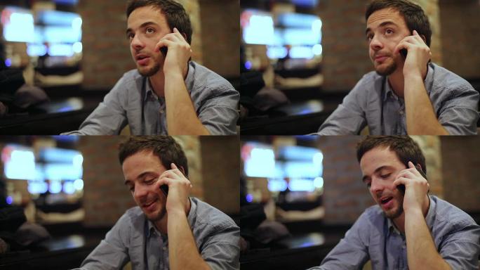 开朗的年轻人在咖啡店使用智能手机