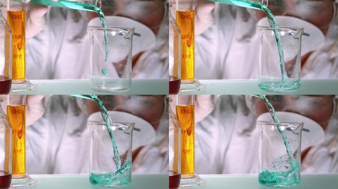科学家将蓝绿色液体倒入烧杯中