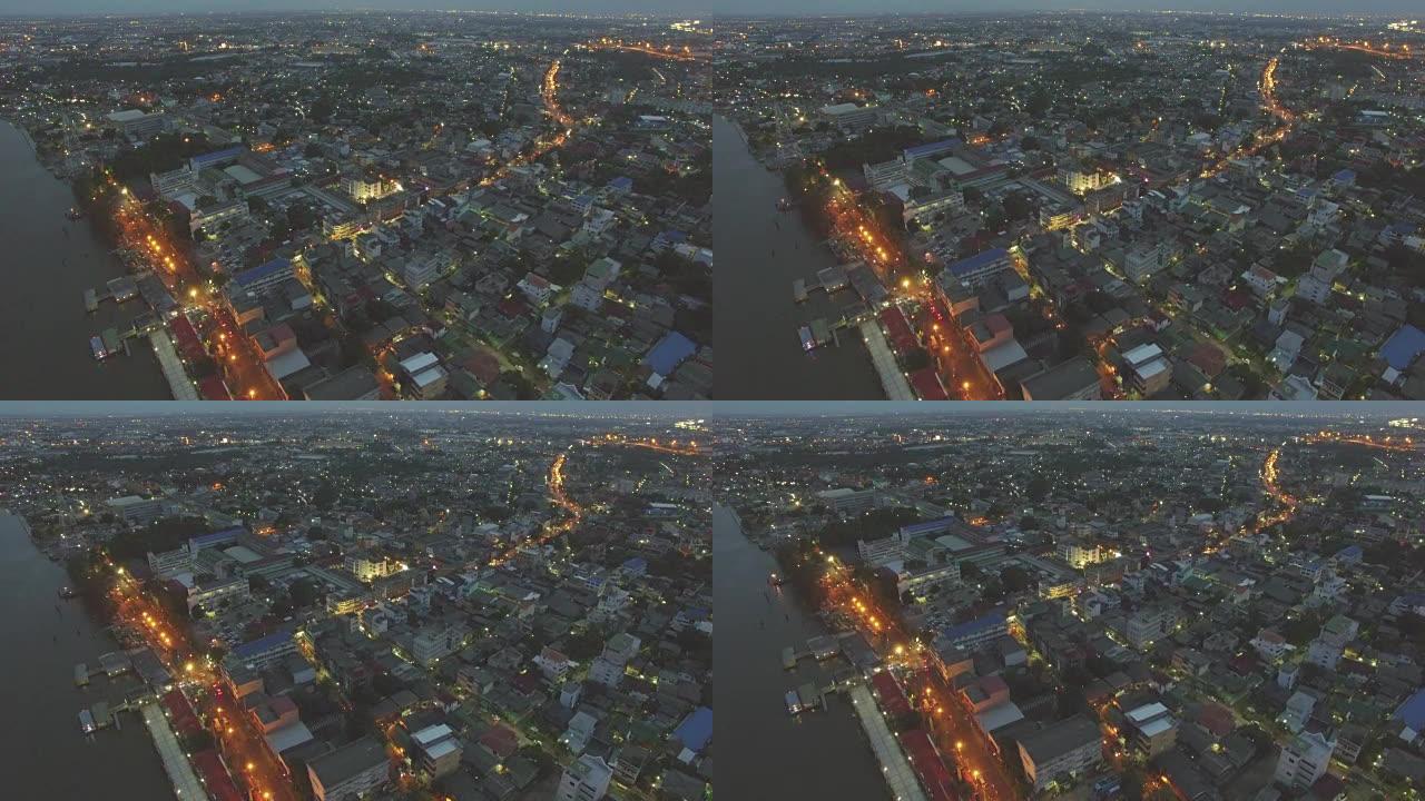 夜间河边城市的鸟瞰图