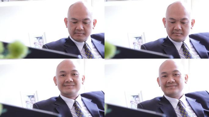 亚洲企业高管在办公室微笑