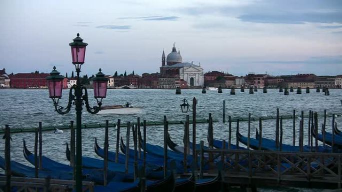 Venice, Italy at night with gondolas, and San Gior