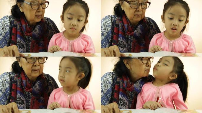 亚洲小女孩和奶奶读书