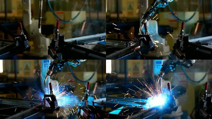 HD：机器人手臂在工厂焊接。（潘宁）