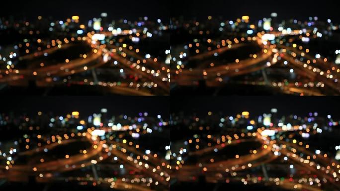 夜间城市交通。汽车前灯和尾灯不聚焦