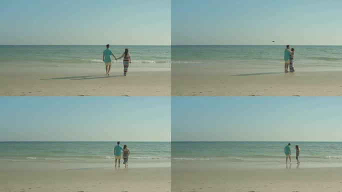 情侣相爱漫步在海滨