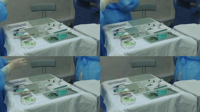 手术室护士用医疗工具将注射器放在桌子上