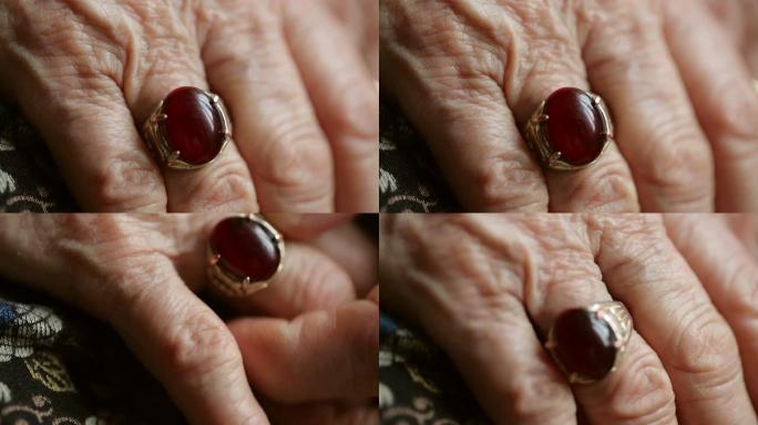 一个布满皱纹的老女人手上戴着一个大戒指的视频