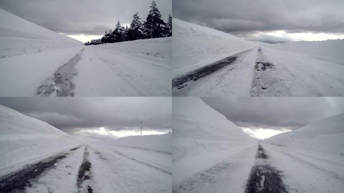 在白雪皑皑的冬季道路上行驶