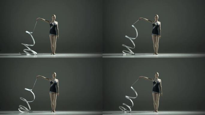 高清超慢动作: 艺术体操运动员旋转丝带