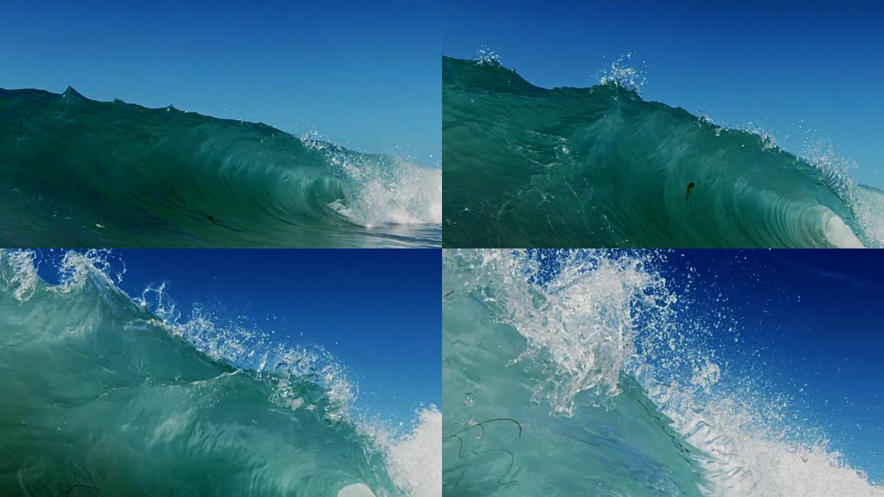 在加利福尼亚夏日的阳光下，波浪在浅沙滩上的相机上破裂，这是一个美丽的波浪视点。在红龙上以300FPS