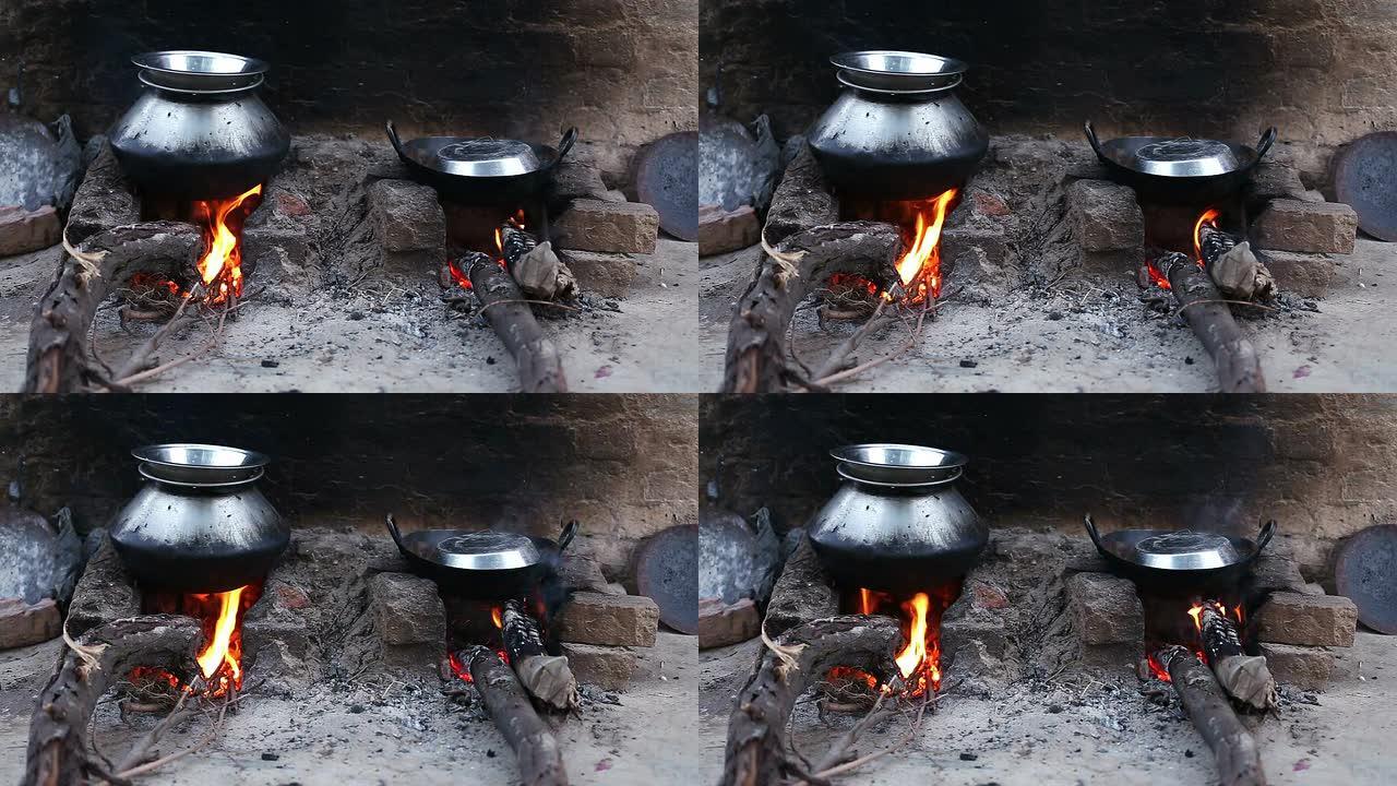 农村燃木炉生火做饭户外野炊柴火饭