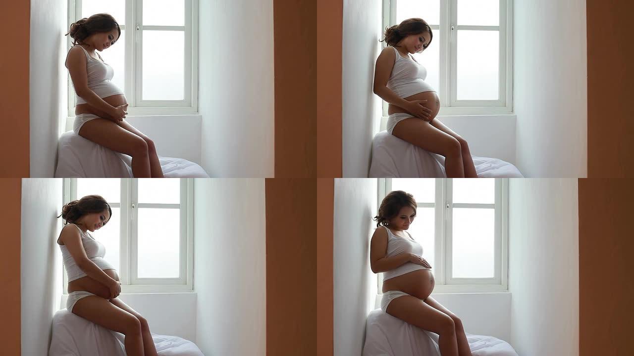 孕妇带窗户灯怀孕准妈妈孕妇大肚子摸肚子