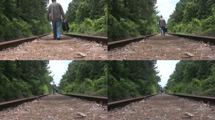 人在铁轨上行走低角度低视角背影从镜头前走