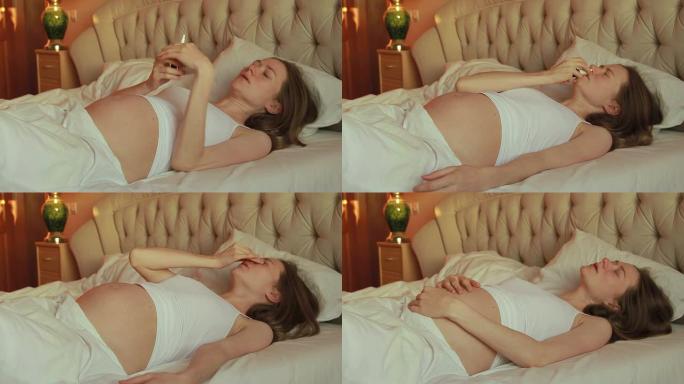 发热躺在床上的孕妇