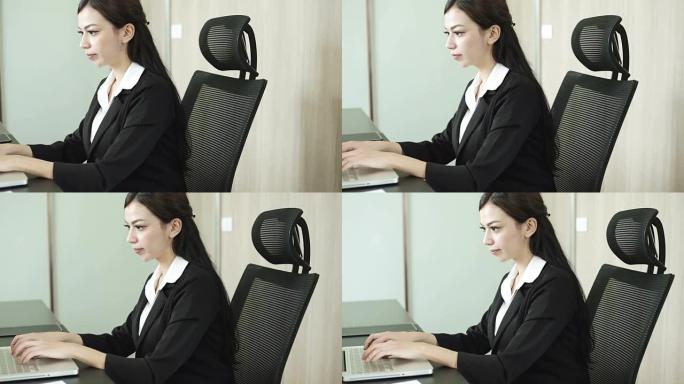 使用笔记本电脑的女商人