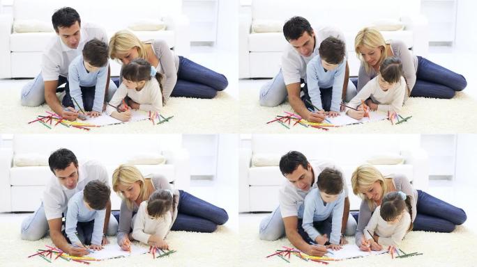 快乐的家庭用彩色铅笔画画。