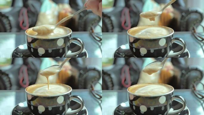 咖啡从勺子流入杯子的慢动作