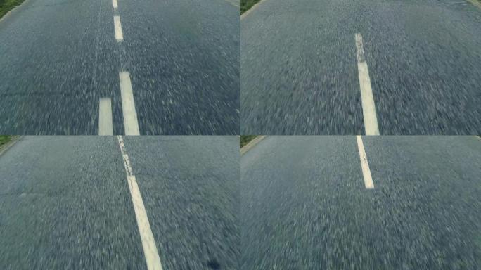 行驶中的沥青路面上的白色条纹