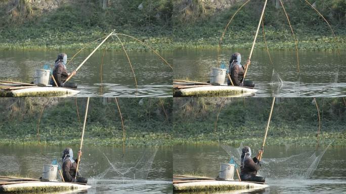 渔民在运河中使用方形渔网