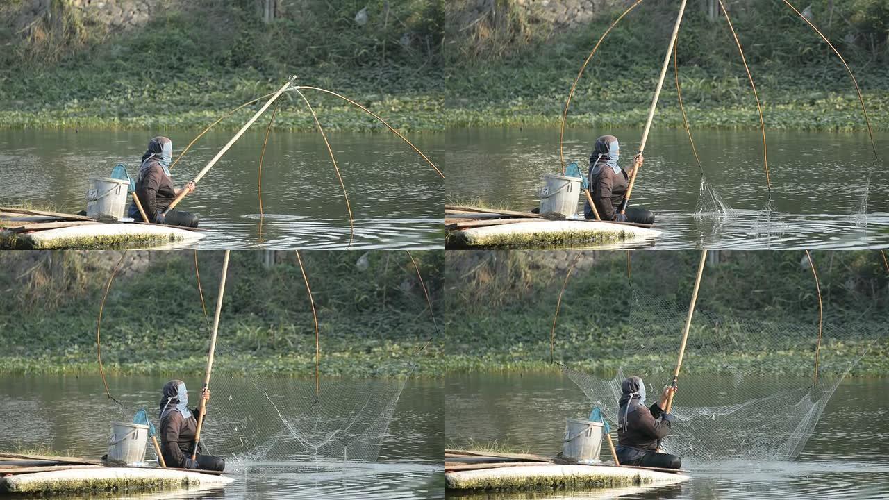 渔民在运河中使用方形渔网