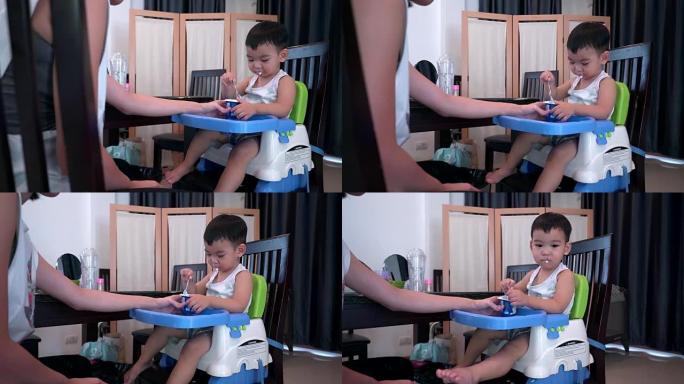 4k Dolly拍摄男婴正在吃酸奶的视频