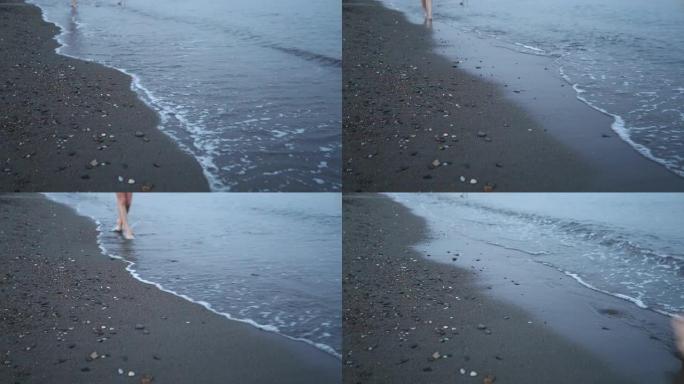 在海滩上散步时的腿特写