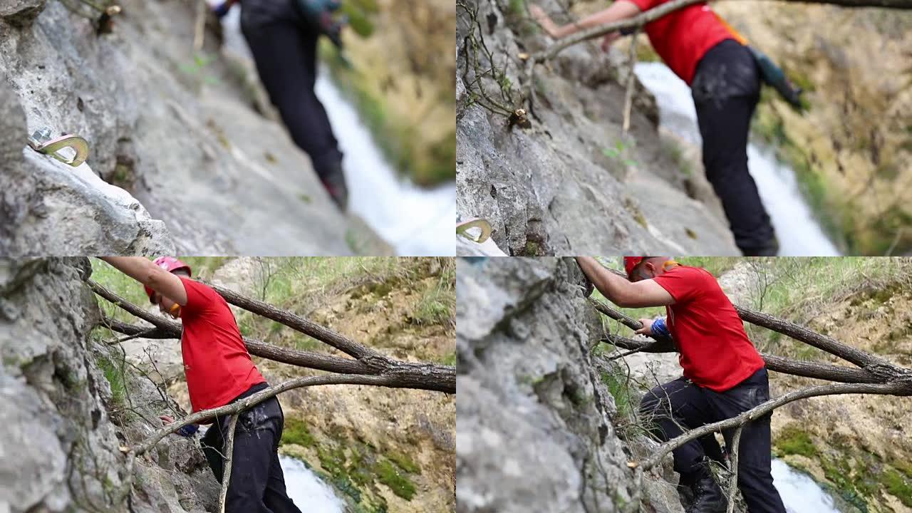 将螺栓固定在岩石上后，登山者继续前进
