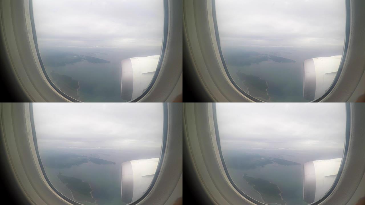 从飞机上观看云海高空机翼机舱窗外