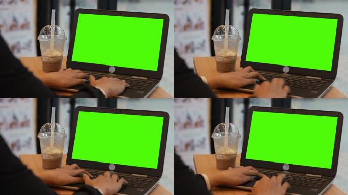 咖啡馆使用数字平板电脑触摸屏设备平板电脑的绿屏手