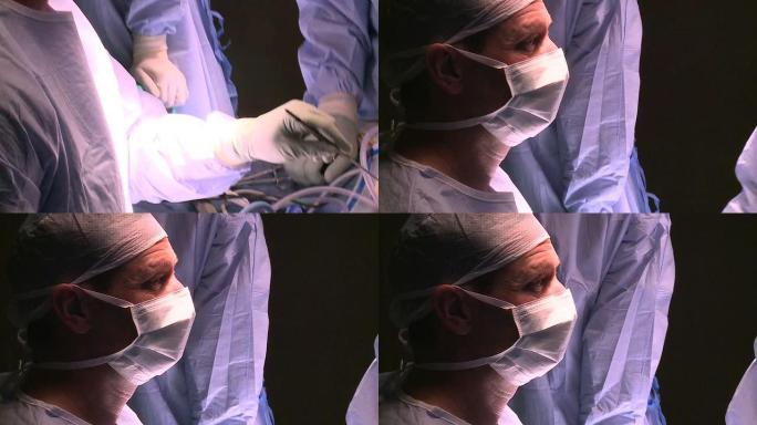 使用现代器械进行手术的外科医生