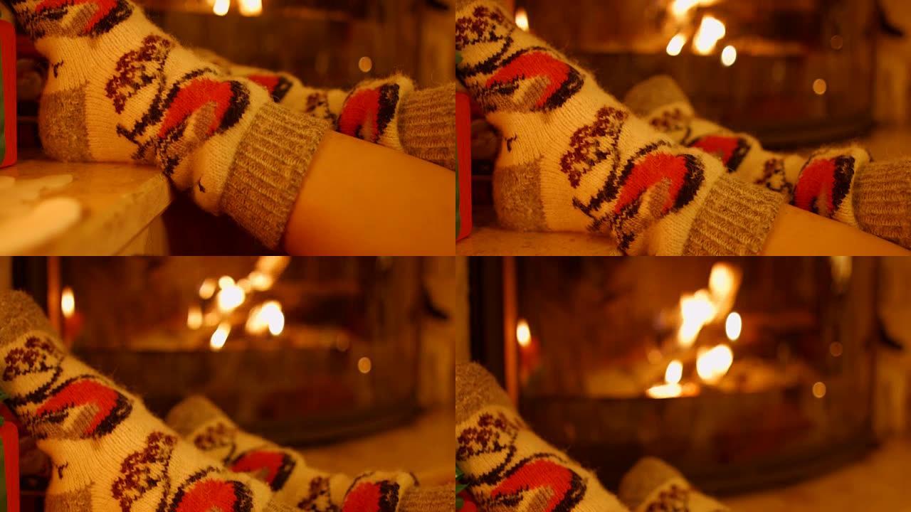壁炉旁穿着保暖袜子的脚女孩