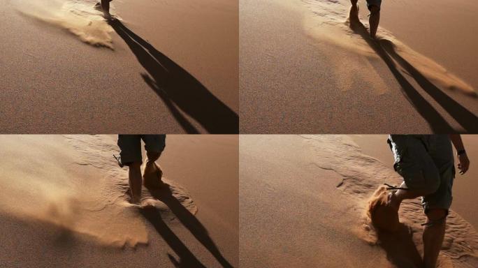 沙滩上的脚印在沙漠中奔跑