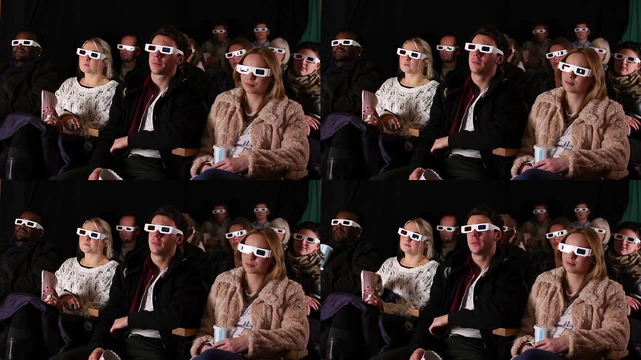 人们戴着3D眼镜在电影院看电影