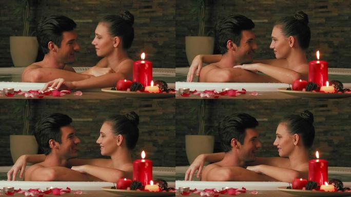 情侣在美容水疗中心的热水浴缸里放松