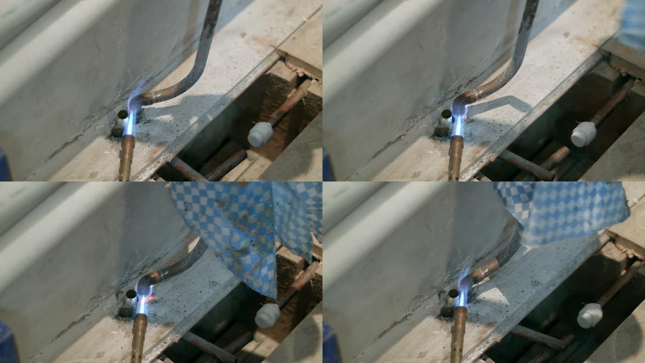 HD：铜管上的焊料被加热以拆卸