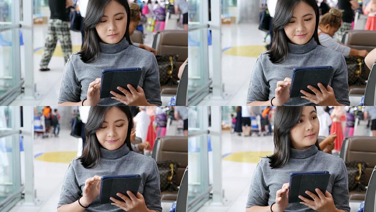 女人在机场使用社交媒体进行交流
