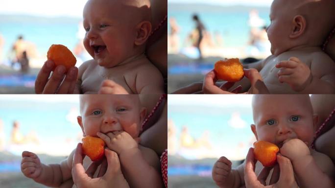 可爱的小宝宝吃甜多汁的桃子